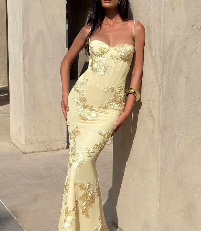 Cream maxi dress with gold floral embroidery and sweetheart bodice lifestyle