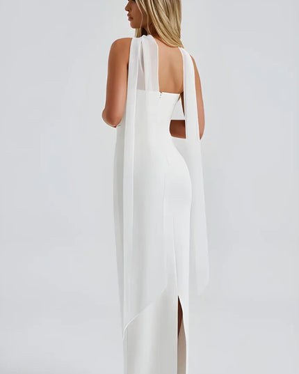 Back view of white strapless bodycon dress with flowing sheer scarf