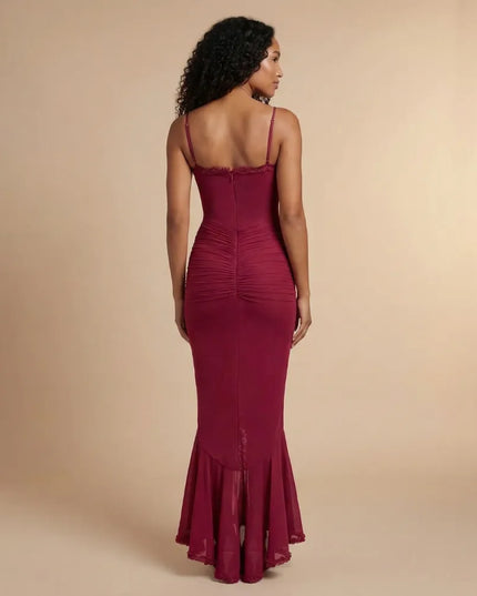 Back view of burgundy spaghetti strap ruched maxi dress with sheer hem