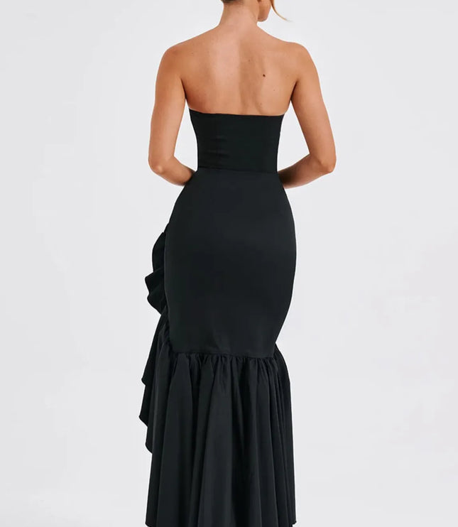 Back view of black strapless maxi dress with layered ruffled slit