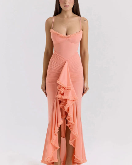 Front view of coral ruffled sweetheart maxi dress with ruched bodice and cascading slit detail