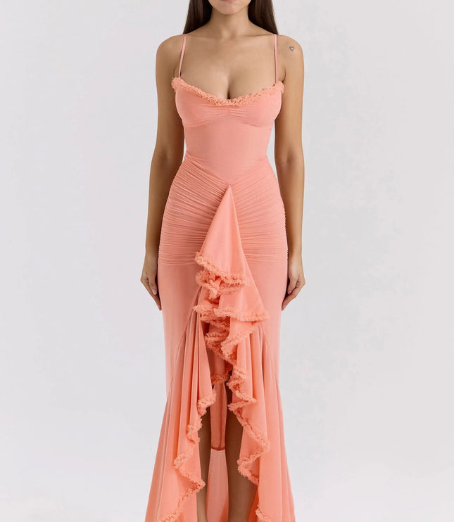 Front view of coral ruffled sweetheart maxi dress with ruched bodice and cascading slit detail