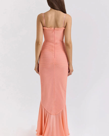 Back view of coral ruffled sweetheart maxi dress with fitted ruched back and floor-length hem