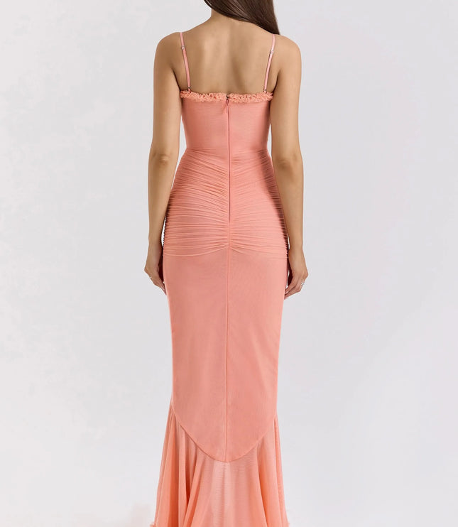 Back view of coral ruffled sweetheart maxi dress with fitted ruched back and floor-length hem