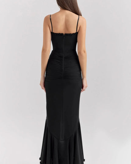 Back view of black ruffled sweetheart maxi dress with straps and ruched bodice
