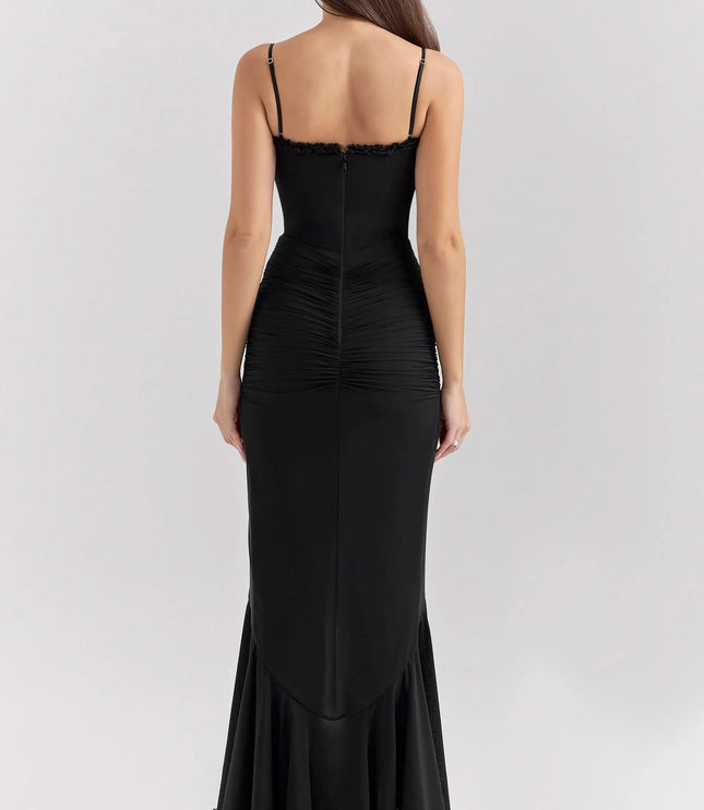 Back view of black ruffled sweetheart maxi dress with straps and ruched bodice