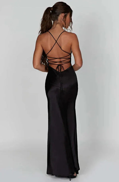 Back view of black satin maxi dress with crisscross open back and lace-up ties