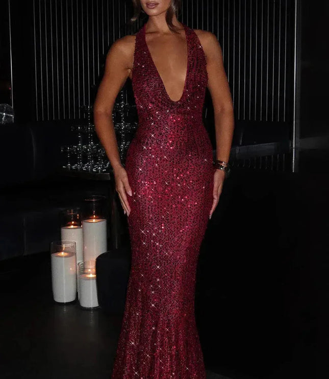 Burgundy sequin halter maxi dress with deep V-neckline and floor-length fit