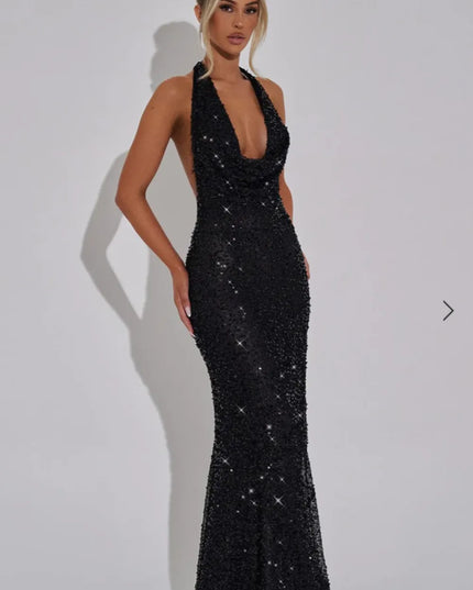 Black sequin halter maxi dress with plunging neckline and fitted silhouette