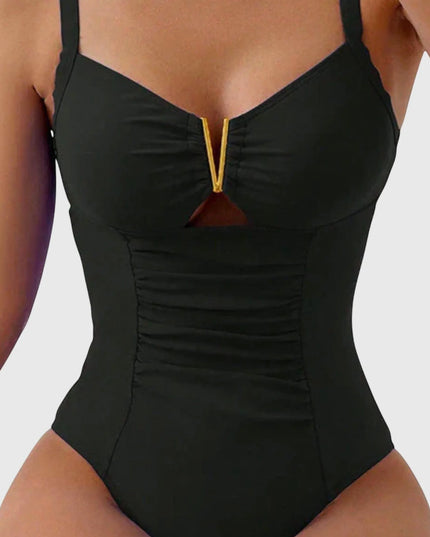 Black ruched v-neck one-piece swimsuit with gold trim detail
