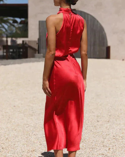 Red sleeveless halter midi dress with open back, worn from behind