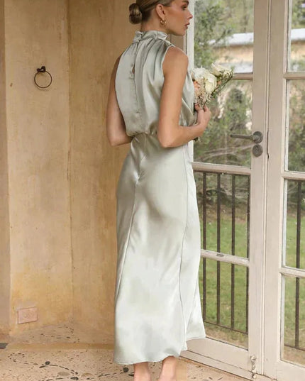 Side profile of sage halter dress with gathered neckline detail
