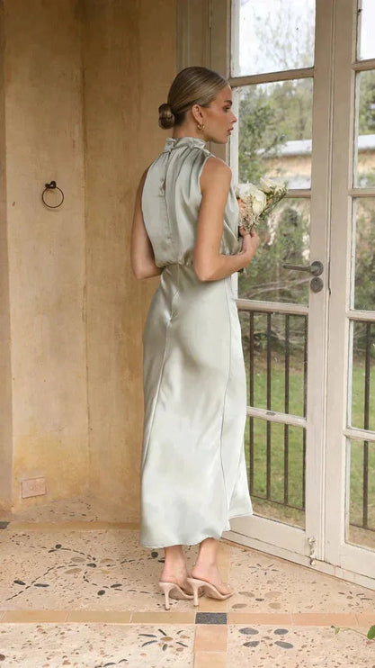 Side profile of sage halter dress with gathered neckline detail