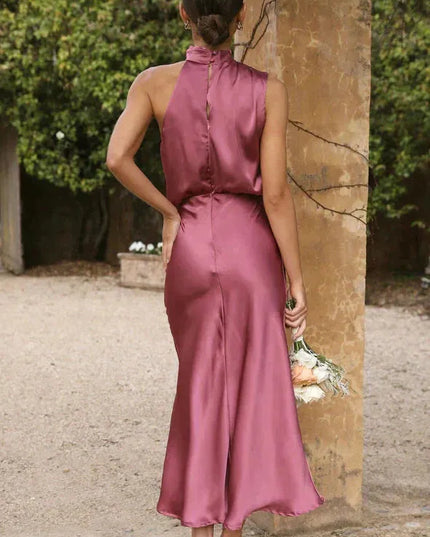 Back view of mauve halter dress showing button-down closure