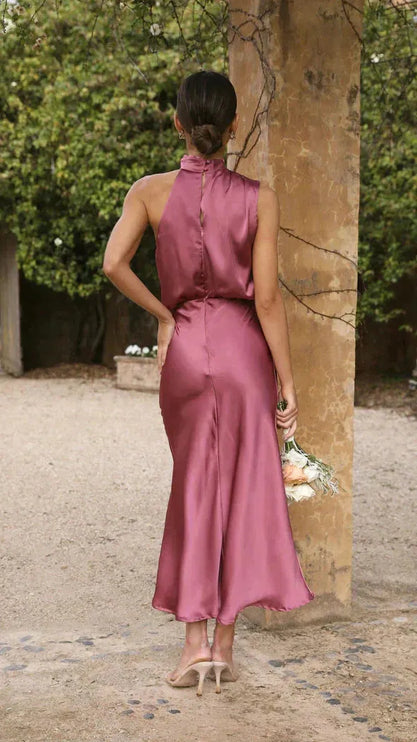Back view of mauve halter dress showing button-down closure