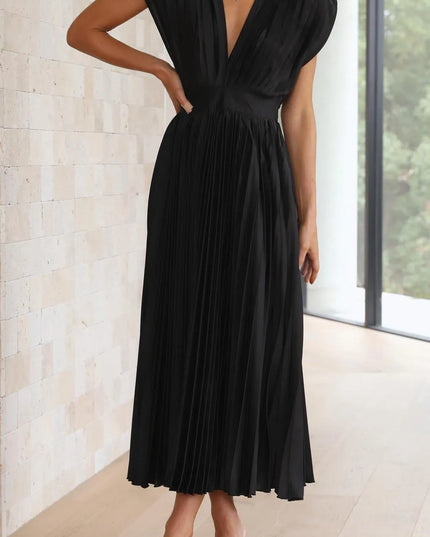 Black pleated midi dress front view with deep v-neckline and cinched waist