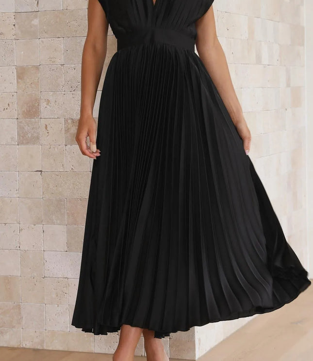 Back view of black pleated midi dress with tie closure detail
