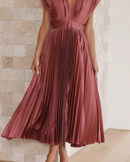 Front facing mauve high waisted midi dress with deep v-neck and pleated bodice