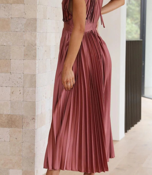 Back view of mauve sleeveless midi dress with open back detail and pleated skirt