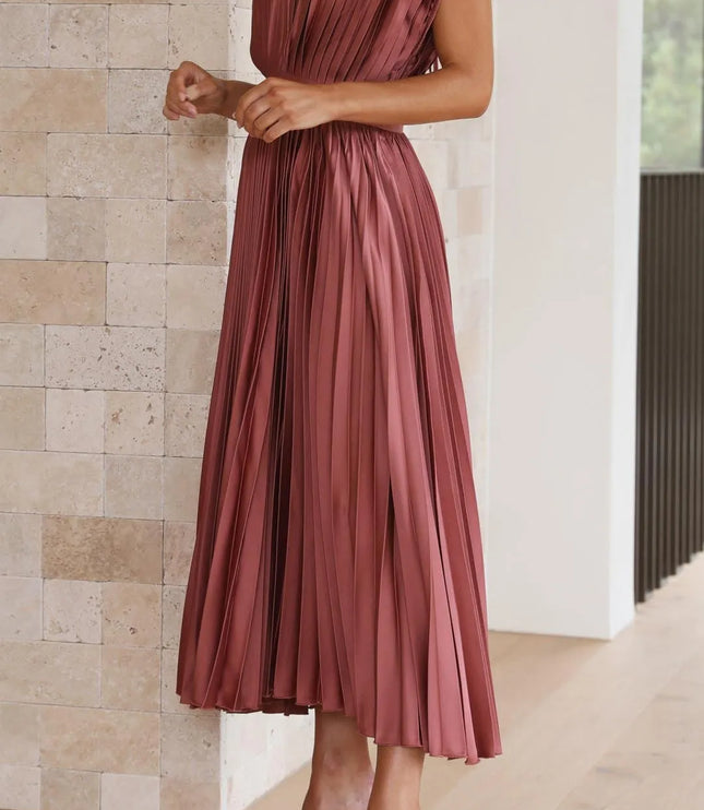 Three-quarter view mauve pleated midi dress showing v-neckline and high waist