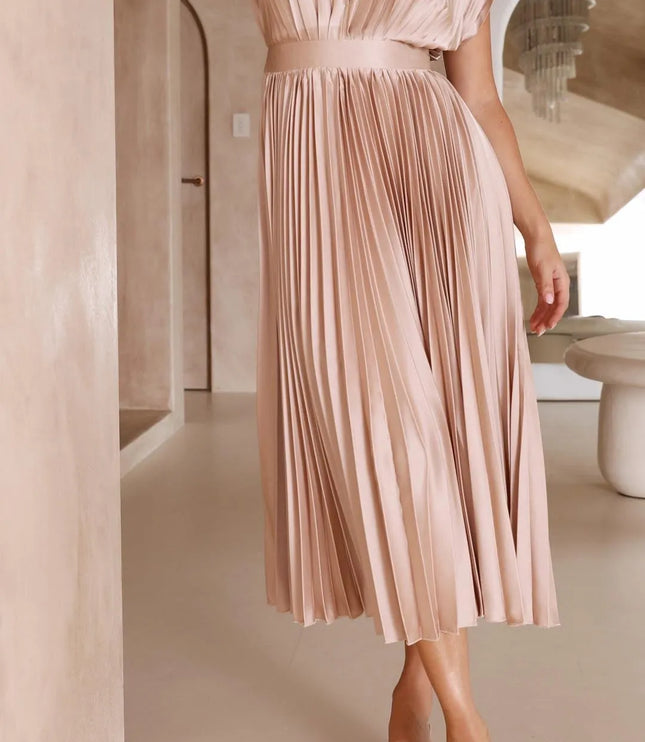 Three-quarter view blush pink pleated midi dress with v-neck and high waistline