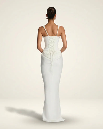 Back view of white maxi dress with lace-up corset back and thin straps