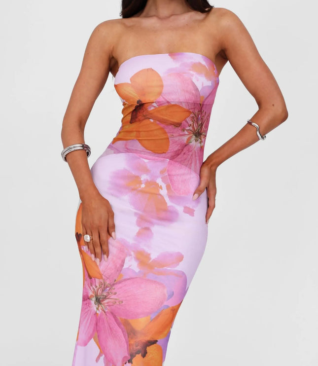 Close-up of strapless floral maxi dress bodice in lilac with pink and orange oversized blooms