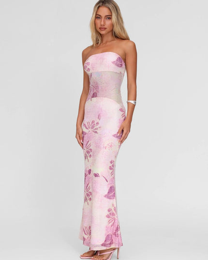 Side angle of pink floral strapless maxi dress showing curve-hugging fit and long hem