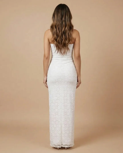 Back view of white strapless lace maxi dress with fitted silhouette and long hem
