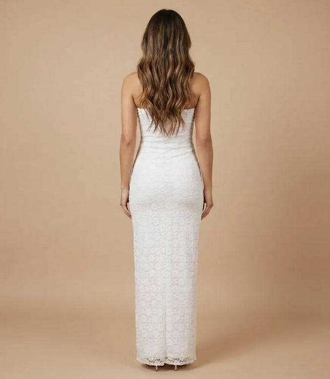 Back view of white strapless lace maxi dress with fitted silhouette and long hem