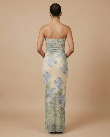 Back view of strapless printed maxi dress with fitted silhouette and floral pattern