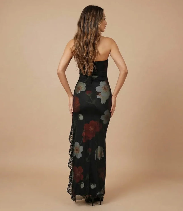 Back view of black strapless printed maxi dress with floral print and lace side detail