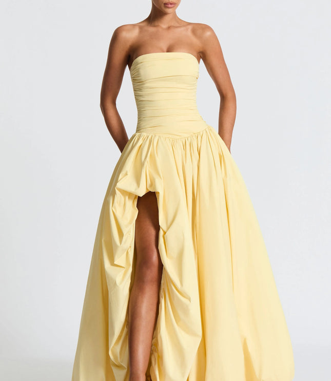 Front view strapless yellow dress with ruched bodice and asymmetrical hemline