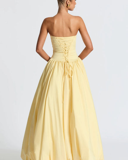 Back view of yellow strapless dress showing lace-up corset detail
