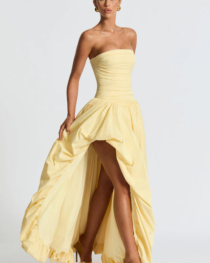 Strapless yellow dress with ruched waist and asymmetrical high-low skirt