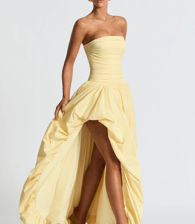 Strapless yellow dress with ruched waist and asymmetrical high-low skirt