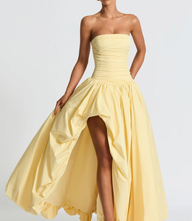 Strapless yellow high-low maxi dress with ruched bodice and flowing skirt