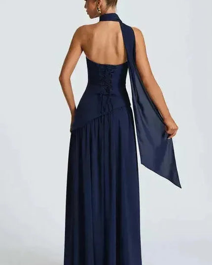 Navy blue strapless maxi dress with halter choker and flowing high slit back view