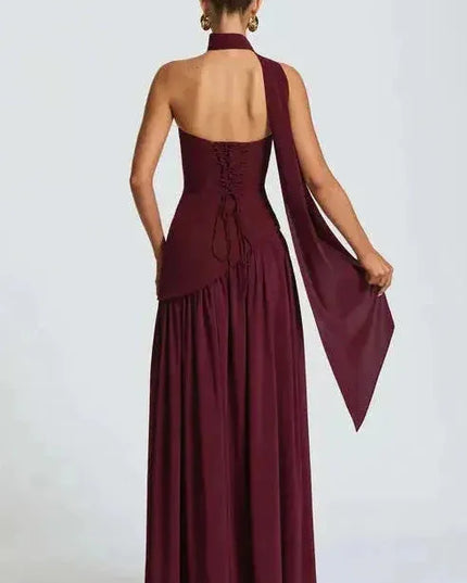 Back view of burgundy maxi dress showing lace-up corset back and high leg slit