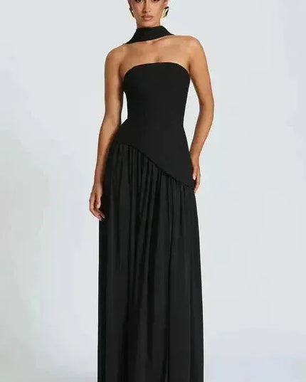 Black strapless maxi dress with asymmetrical high slit and draped neckline detail