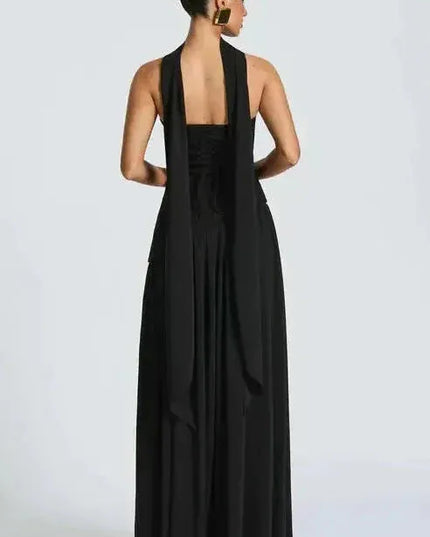 Back view of black strapless maxi dress with open back and high slit leg opening