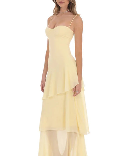 Side view of women sweetheart spaghetti strap layered maxi dress with fitted bodice and flowing layered hem