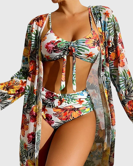 White tropical floral bikini with ruched top, high-waist bottoms, and long-sleeve cover-up robe