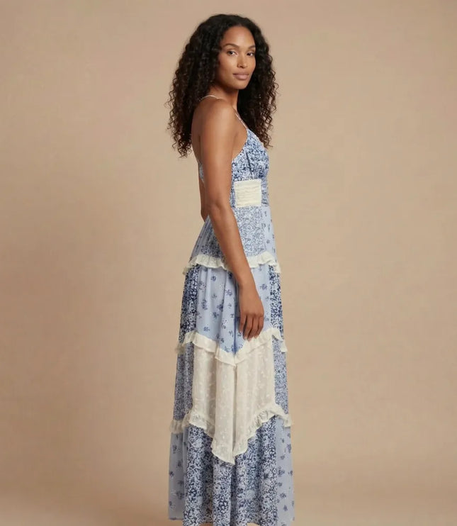 Blue floral V-neck maxi dress with tiered ruffles and cream trim, side view