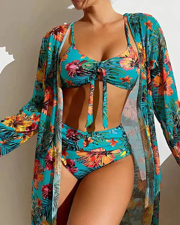 Women tropical bikini set with turquoise base, colorful flower print, and matching cover-up