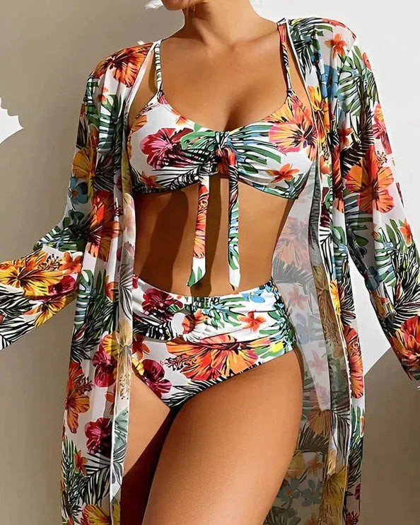 Women floral tropical bikini set with white base, colorful flowers, and matching cover-up cardigan