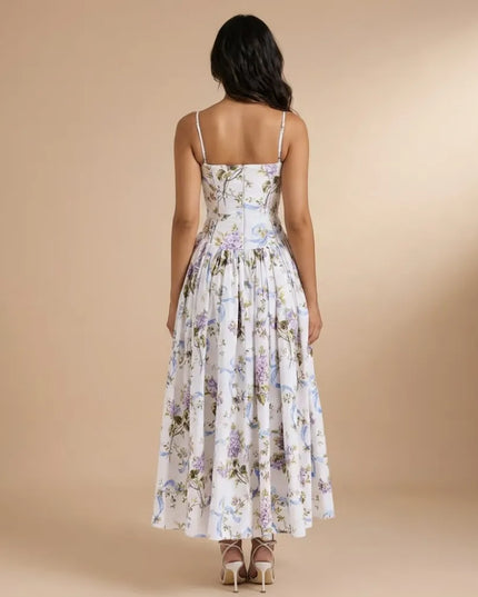 Back view of floral strapless midi dress with thin straps and full gathered skirt