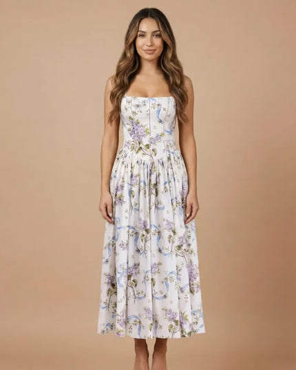 Front view of women floral strapless midi dress with white base and purple blue print
