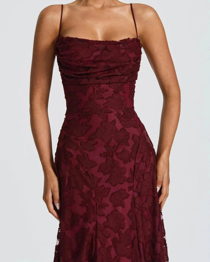 Close-up burgundy floral cowl neck maxi dress bodice with ruched drape and thin straps