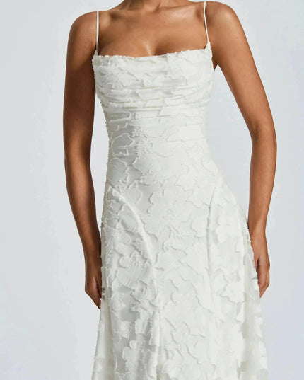 Close-up of white floral cowl neck maxi dress bodice with textured floral overlay